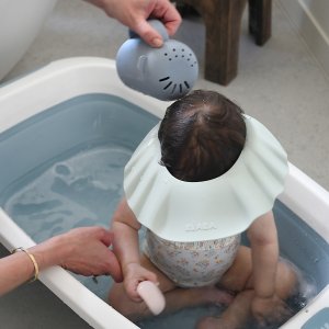 Rince tête bébé en silicone galet Beaba