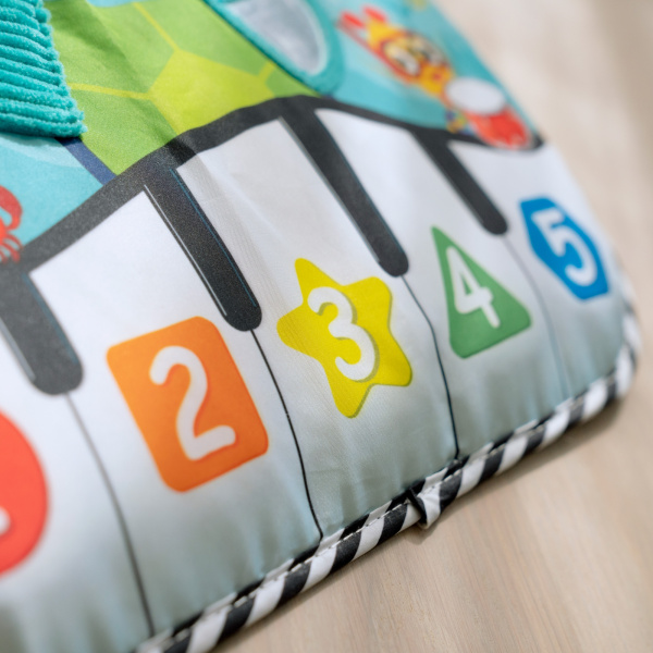 Jouet à suspendre piano musical neptune's kick & explore Baby einstein