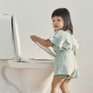 Réducteur de toilette blanc et gris Babybjorn