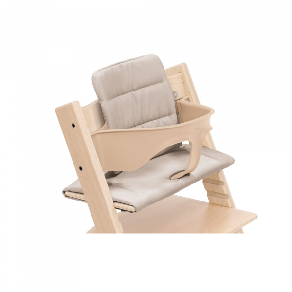 Pack chaise haute tripp trapp avec son baby set et son coussin naturel Stokke